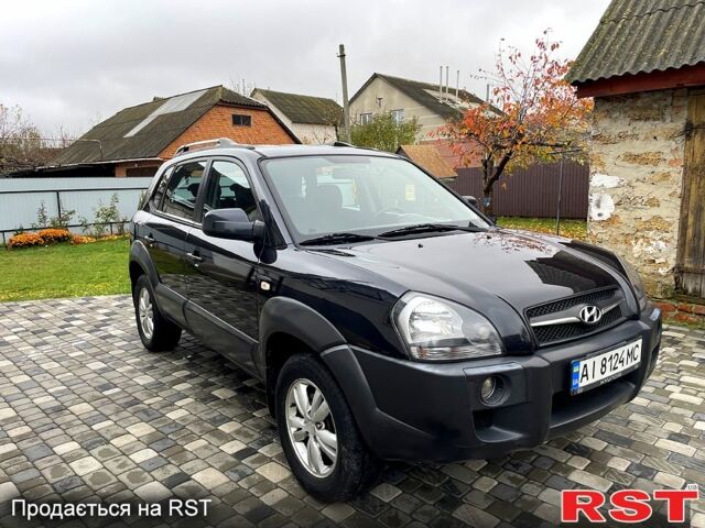Чорний Хендай Туксон, об'ємом двигуна 2 л та пробігом 200 тис. км за 8499 $, фото 2 на Automoto.ua