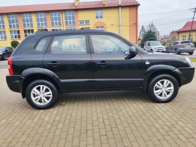 Чорний Хендай Туксон, об'ємом двигуна 1.98 л та пробігом 148 тис. км за 6199 $, фото 4 на Automoto.ua