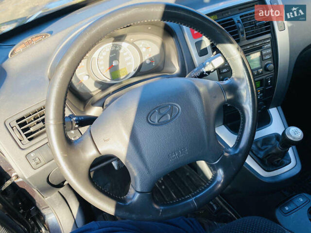 Черный Хендай Туксон, объемом двигателя 1.99 л и пробегом 95 тыс. км за 8700 $, фото 14 на Automoto.ua