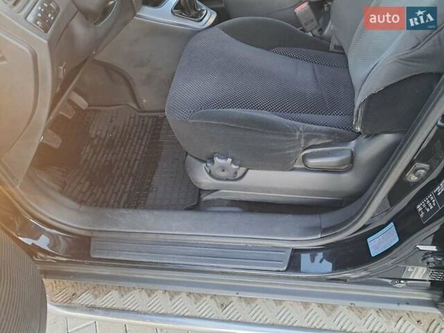 Черный Хендай Туксон, объемом двигателя 1.98 л и пробегом 233 тыс. км за 7850 $, фото 11 на Automoto.ua