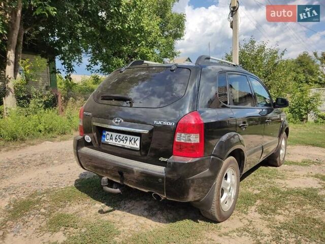 Чорний Хендай Туксон, об'ємом двигуна 1.98 л та пробігом 145 тис. км за 10000 $, фото 4 на Automoto.ua