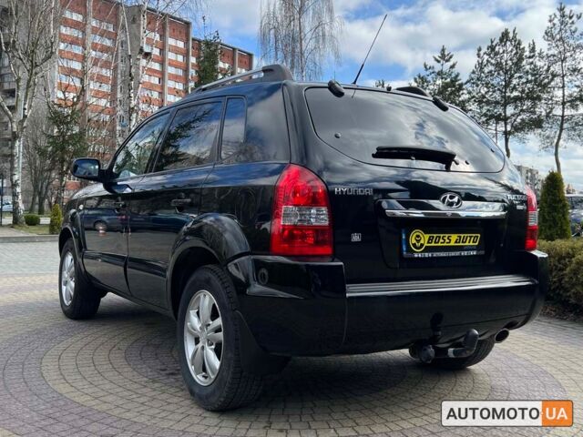 Чорний Хендай Туксон, об'ємом двигуна 2 л та пробігом 246 тис. км за 7999 $, фото 4 на Automoto.ua
