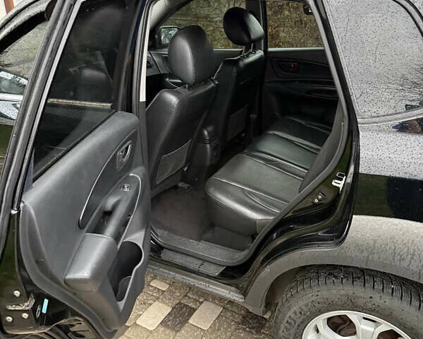 Черный Хендай Туксон, объемом двигателя 2.66 л и пробегом 205 тыс. км за 10000 $, фото 36 на Automoto.ua