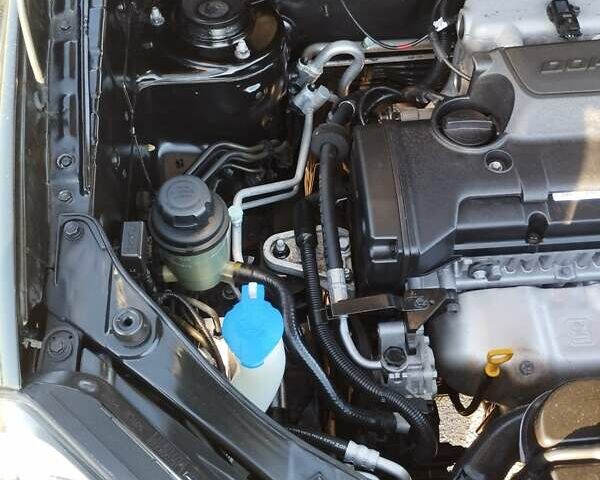 Черный Хендай Туксон, объемом двигателя 1.99 л и пробегом 159 тыс. км за 9700 $, фото 8 на Automoto.ua