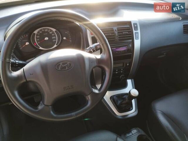 Черный Хендай Туксон, объемом двигателя 1.99 л и пробегом 159 тыс. км за 9700 $, фото 21 на Automoto.ua