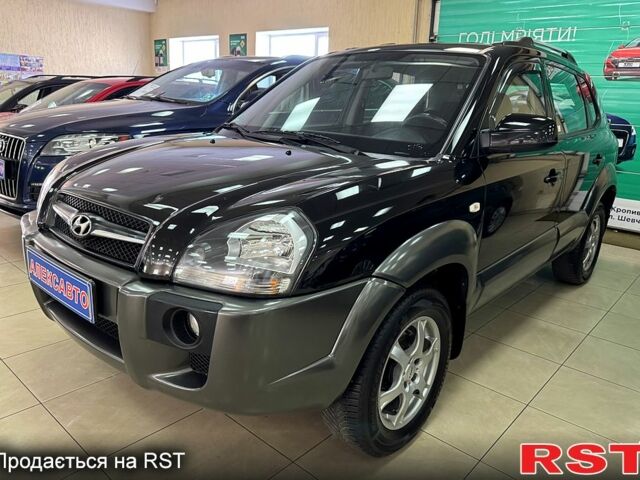 Черный Хендай Туксон, объемом двигателя 2 л и пробегом 160 тыс. км за 8800 $, фото 1 на Automoto.ua