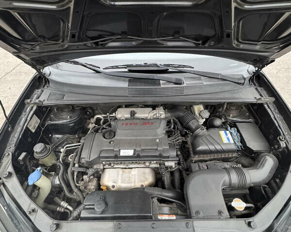 Чорний Хендай Туксон, об'ємом двигуна 2 л та пробігом 120 тис. км за 9000 $, фото 10 на Automoto.ua