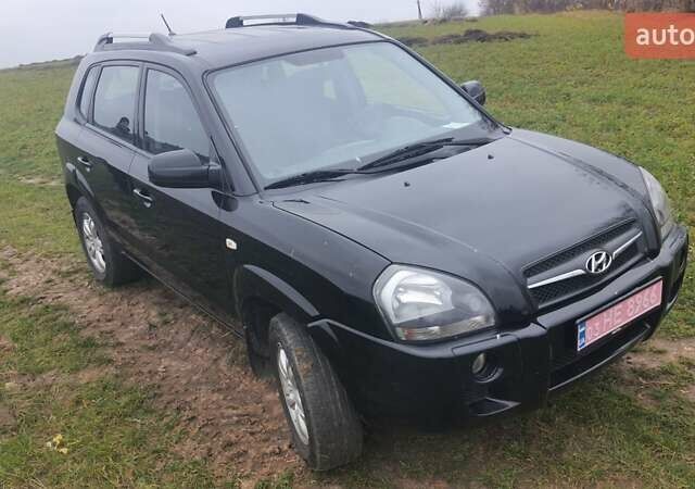 Черный Хендай Туксон, объемом двигателя 2 л и пробегом 198 тыс. км за 8200 $, фото 9 на Automoto.ua