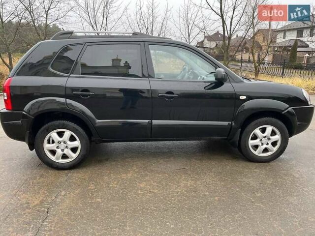 Черный Хендай Туксон, объемом двигателя 2 л и пробегом 128 тыс. км за 9200 $, фото 6 на Automoto.ua