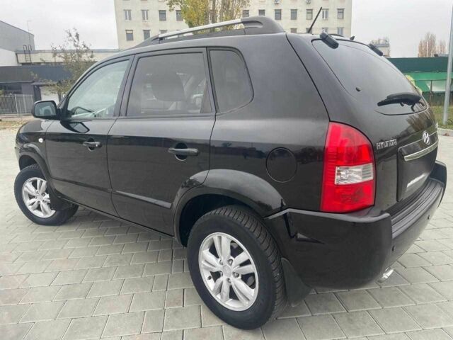 Черный Хендай Туксон, объемом двигателя 2 л и пробегом 168 тыс. км за 7500 $, фото 5 на Automoto.ua