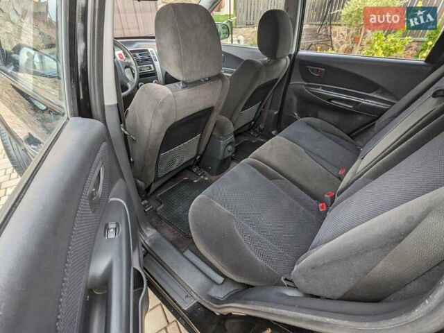 Чорний Хендай Туксон, об'ємом двигуна 2 л та пробігом 217 тис. км за 7700 $, фото 12 на Automoto.ua
