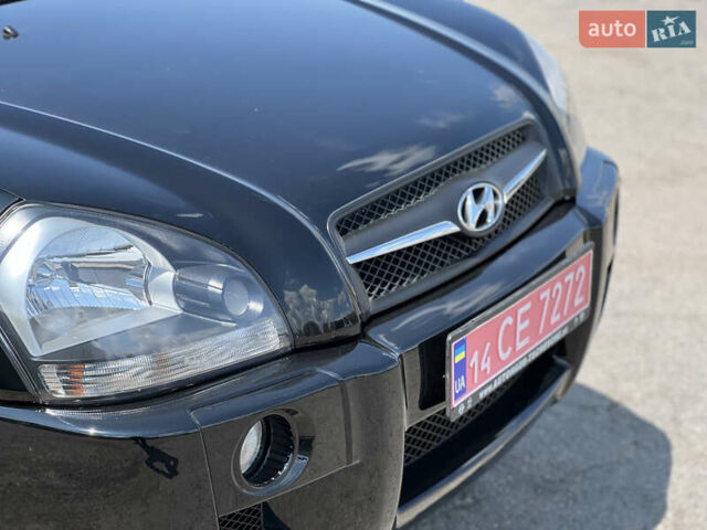 Чорний Хендай Туксон, об'ємом двигуна 2 л та пробігом 163 тис. км за 9199 $, фото 9 на Automoto.ua