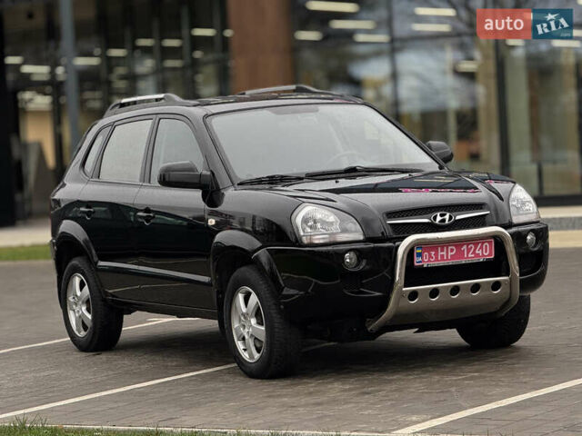 Черный Хендай Туксон, объемом двигателя 1.98 л и пробегом 202 тыс. км за 7650 $, фото 6 на Automoto.ua