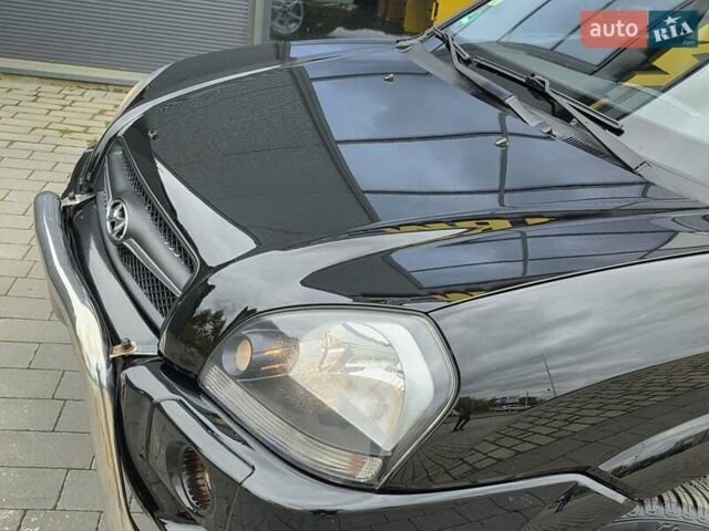 Чорний Хендай Туксон, об'ємом двигуна 2 л та пробігом 93 тис. км за 9750 $, фото 14 на Automoto.ua