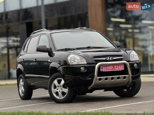 Черный Хендай Туксон, объемом двигателя 1.98 л и пробегом 202 тыс. км за 7650 $, фото 5 на Automoto.ua