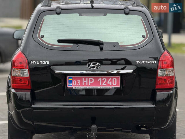 Черный Хендай Туксон, объемом двигателя 1.98 л и пробегом 202 тыс. км за 7650 $, фото 8 на Automoto.ua