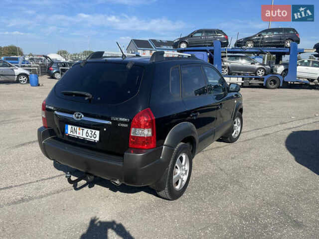 Чорний Хендай Туксон, об'ємом двигуна 2 л та пробігом 185 тис. км за 7944 $, фото 13 на Automoto.ua