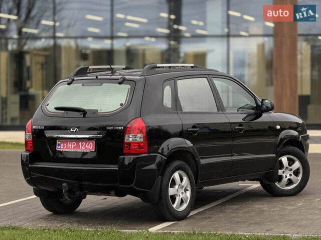 Черный Хендай Туксон, объемом двигателя 1.98 л и пробегом 202 тыс. км за 7650 $, фото 9 на Automoto.ua