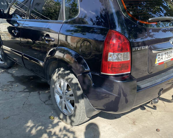 Черный Хендай Туксон, объемом двигателя 1.98 л и пробегом 245 тыс. км за 9000 $, фото 3 на Automoto.ua