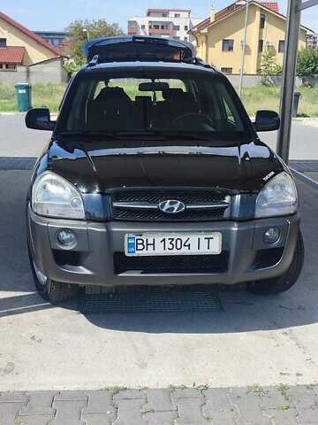 Черный Хендай Туксон, объемом двигателя 2 л и пробегом 141 тыс. км за 8500 $, фото 4 на Automoto.ua