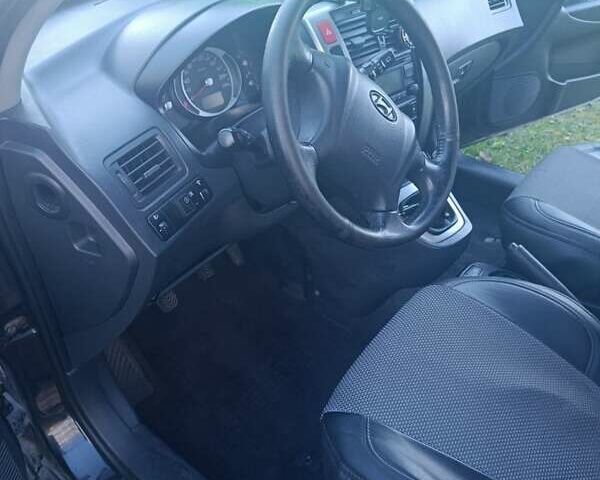 Черный Хендай Туксон, объемом двигателя 1.98 л и пробегом 298 тыс. км за 9300 $, фото 2 на Automoto.ua