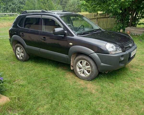 Черный Хендай Туксон, объемом двигателя 1.98 л и пробегом 220 тыс. км за 8500 $, фото 1 на Automoto.ua