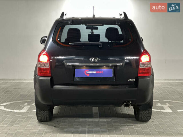 Черный Хендай Туксон, объемом двигателя 1.98 л и пробегом 129 тыс. км за 10600 $, фото 5 на Automoto.ua