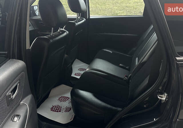 Черный Хендай Туксон, объемом двигателя 1.98 л и пробегом 129 тыс. км за 10600 $, фото 12 на Automoto.ua