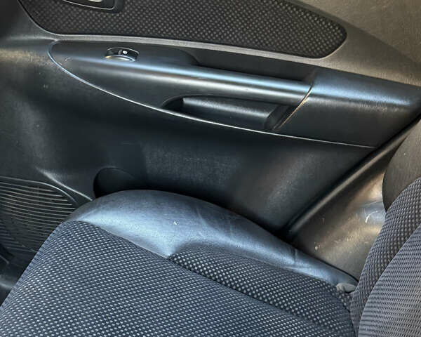 Черный Хендай Туксон, объемом двигателя 1.98 л и пробегом 218 тыс. км за 9350 $, фото 7 на Automoto.ua