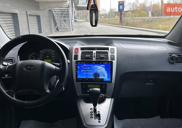 Черный Хендай Туксон, объемом двигателя 1.98 л и пробегом 129 тыс. км за 10600 $, фото 10 на Automoto.ua