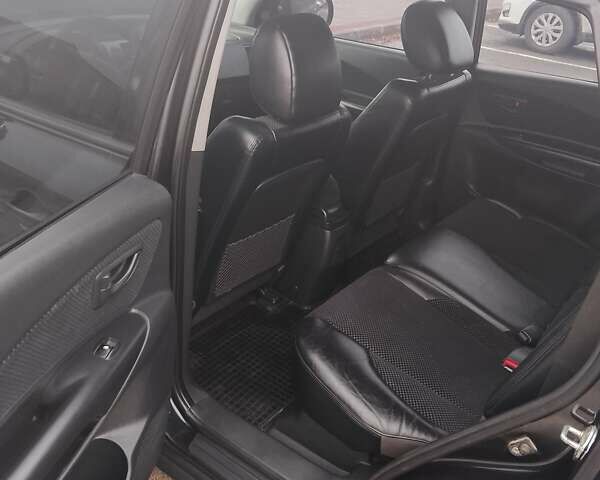 Черный Хендай Туксон, объемом двигателя 1.98 л и пробегом 214 тыс. км за 9100 $, фото 4 на Automoto.ua