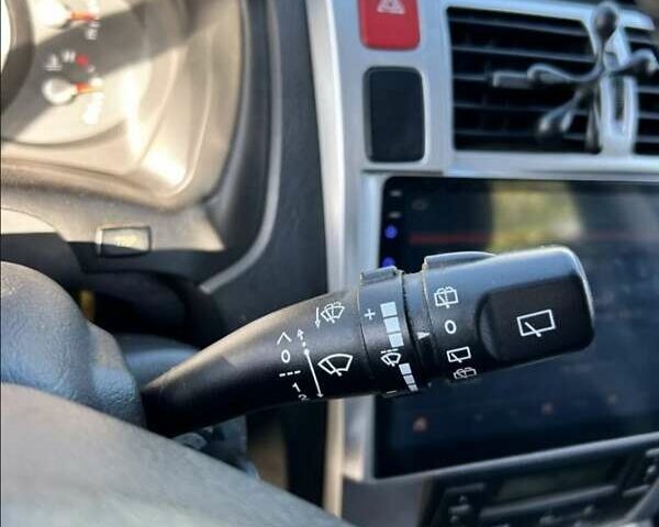 Черный Хендай Туксон, объемом двигателя 1.98 л и пробегом 186 тыс. км за 9500 $, фото 1 на Automoto.ua