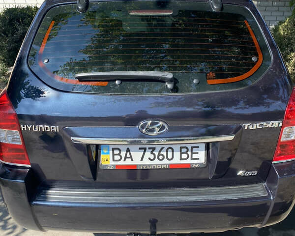 Черный Хендай Туксон, объемом двигателя 1.98 л и пробегом 245 тыс. км за 9000 $, фото 2 на Automoto.ua