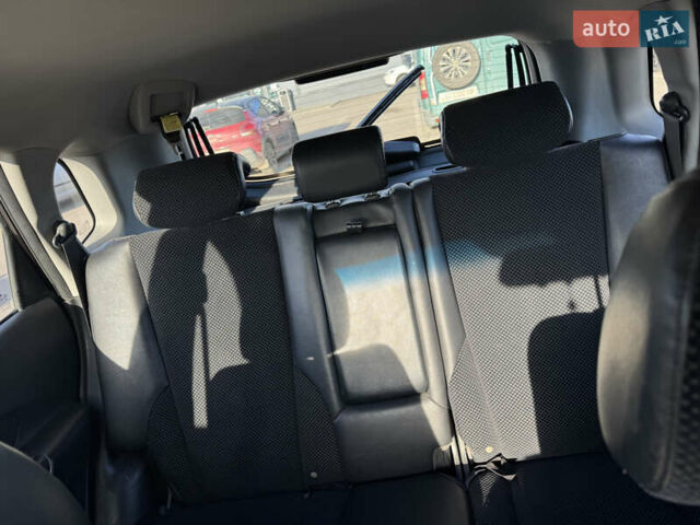 Черный Хендай Туксон, объемом двигателя 1.98 л и пробегом 218 тыс. км за 9350 $, фото 14 на Automoto.ua