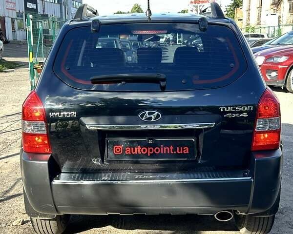 Черный Хендай Туксон, объемом двигателя 1.98 л и пробегом 185 тыс. км за 9500 $, фото 10 на Automoto.ua