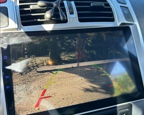 Черный Хендай Туксон, объемом двигателя 1.98 л и пробегом 186 тыс. км за 9500 $, фото 11 на Automoto.ua