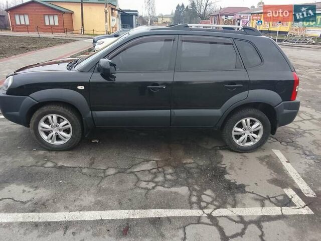 Черный Хендай Туксон, объемом двигателя 1.98 л и пробегом 214 тыс. км за 9100 $, фото 10 на Automoto.ua