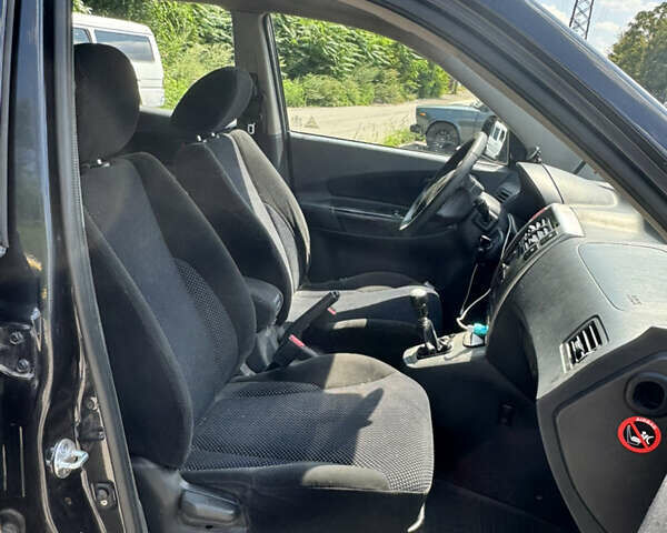 Черный Хендай Туксон, объемом двигателя 1.98 л и пробегом 252 тыс. км за 7999 $, фото 16 на Automoto.ua