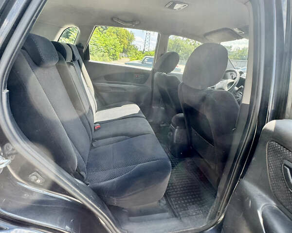 Черный Хендай Туксон, объемом двигателя 1.98 л и пробегом 252 тыс. км за 7999 $, фото 14 на Automoto.ua