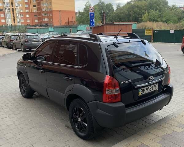 Черный Хендай Туксон, объемом двигателя 1.98 л и пробегом 312 тыс. км за 8500 $, фото 15 на Automoto.ua