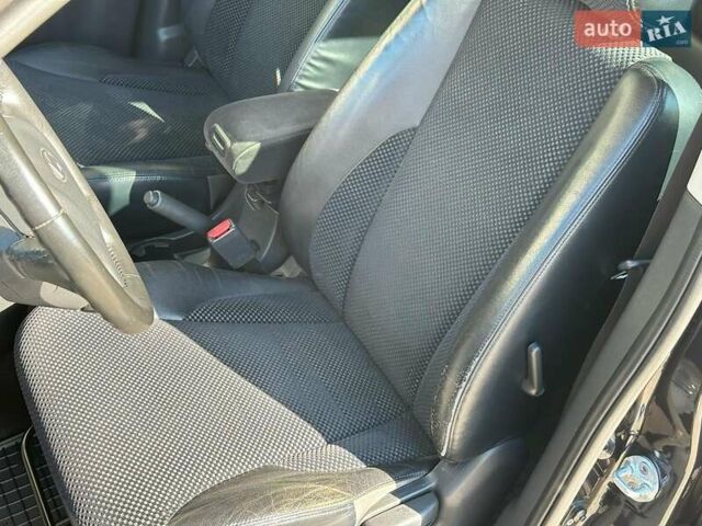 Черный Хендай Туксон, объемом двигателя 2 л и пробегом 255 тыс. км за 9290 $, фото 12 на Automoto.ua