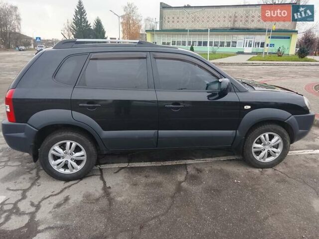 Черный Хендай Туксон, объемом двигателя 1.98 л и пробегом 214 тыс. км за 9100 $, фото 9 на Automoto.ua