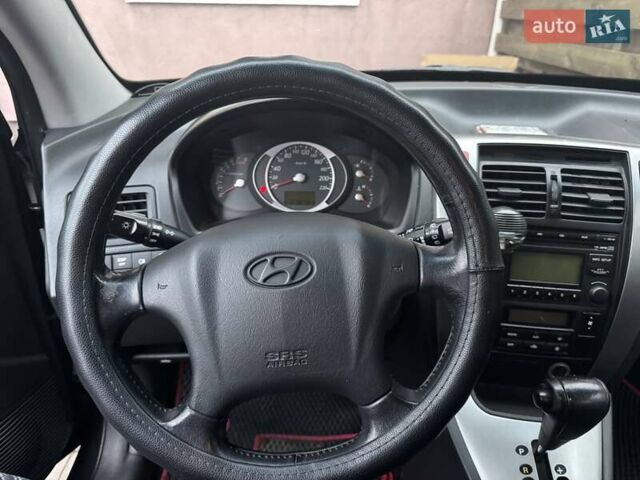 Черный Хендай Туксон, объемом двигателя 1.98 л и пробегом 218 тыс. км за 9350 $, фото 17 на Automoto.ua