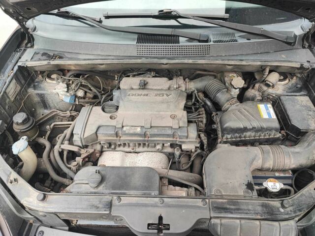 Чорний Хендай Туксон, об'ємом двигуна 2 л та пробігом 387 тис. км за 7000 $, фото 12 на Automoto.ua