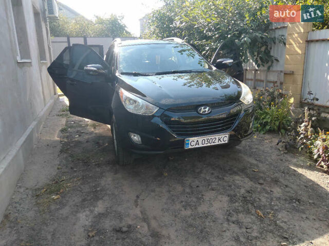 Черный Хендай Туксон, объемом двигателя 2.36 л и пробегом 151 тыс. км за 13000 $, фото 3 на Automoto.ua