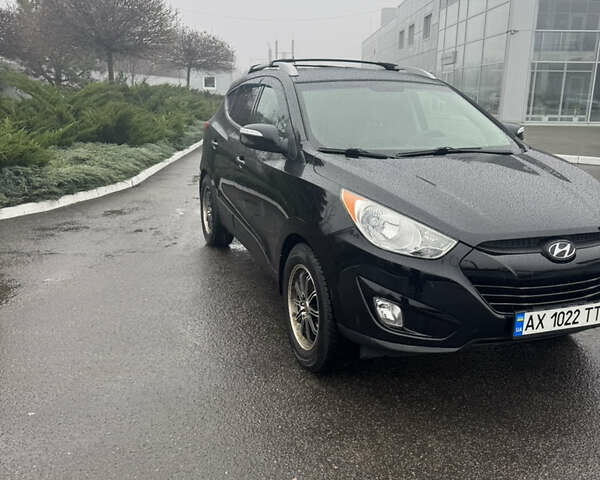 Черный Хендай Туксон, объемом двигателя 2.4 л и пробегом 143 тыс. км за 12000 $, фото 2 на Automoto.ua