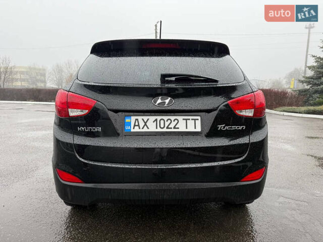 Черный Хендай Туксон, объемом двигателя 2.4 л и пробегом 143 тыс. км за 12000 $, фото 13 на Automoto.ua