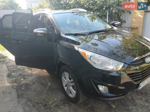 Черный Хендай Туксон, объемом двигателя 2.36 л и пробегом 151 тыс. км за 13000 $, фото 1 на Automoto.ua