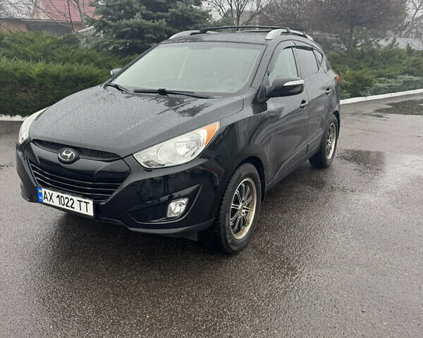 Черный Хендай Туксон, объемом двигателя 2.4 л и пробегом 143 тыс. км за 12000 $, фото 8 на Automoto.ua