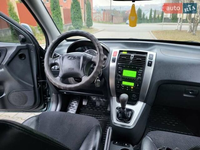 Чорний Хендай Туксон, об'ємом двигуна 1.98 л та пробігом 160 тис. км за 10300 $, фото 113 на Automoto.ua